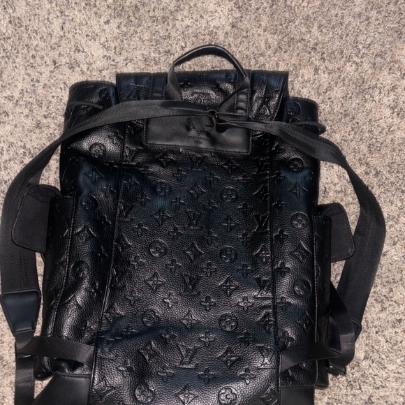 All black Louis Vuitton back pack.